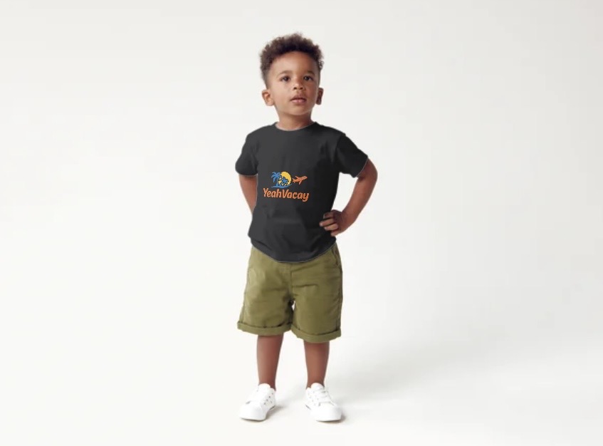 Child wearing YeahVacay branded black t-shirt, standing pose