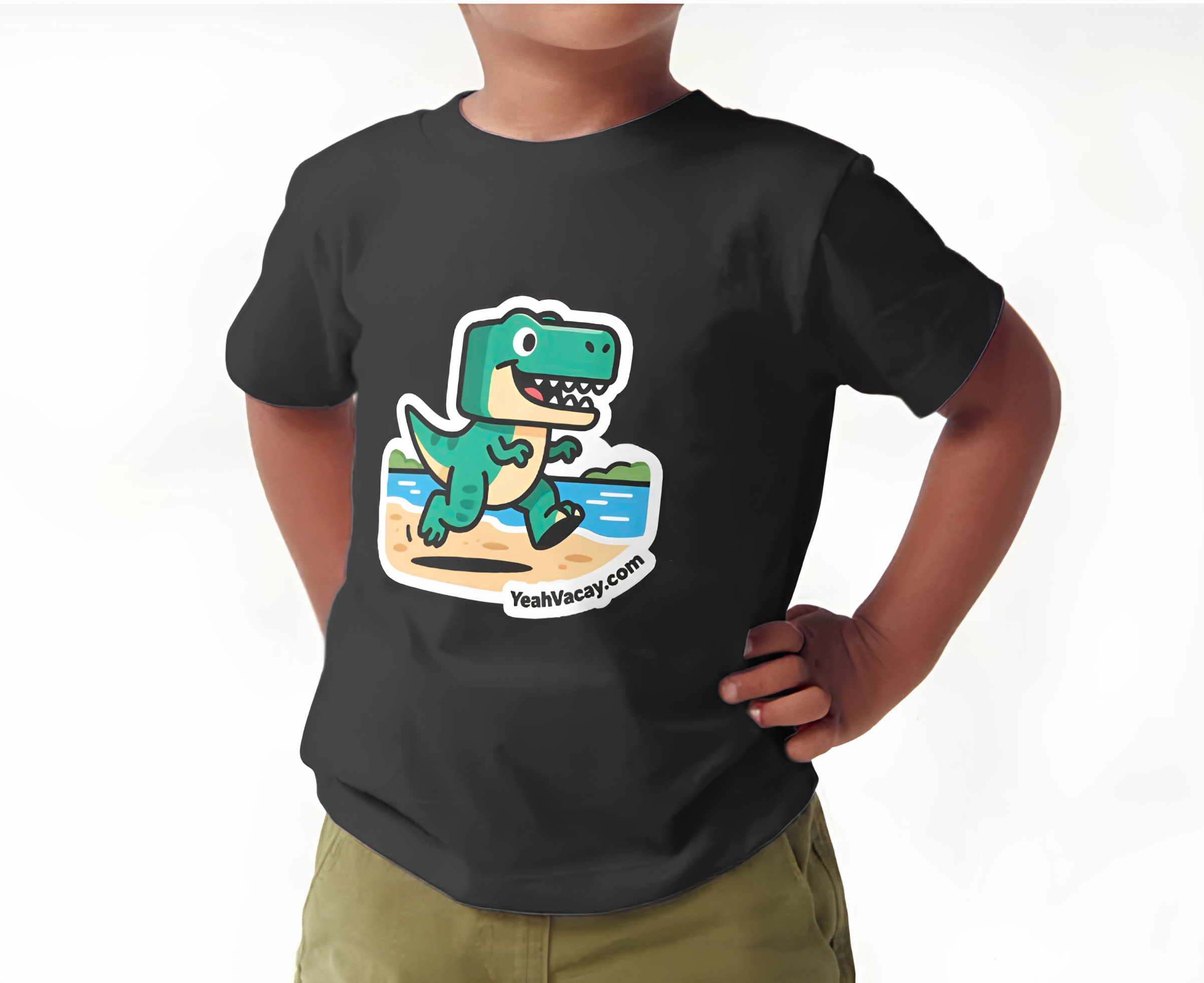Photograph: toddler seated wearing YeahVacay black t-shirt with logo chest print — smiling