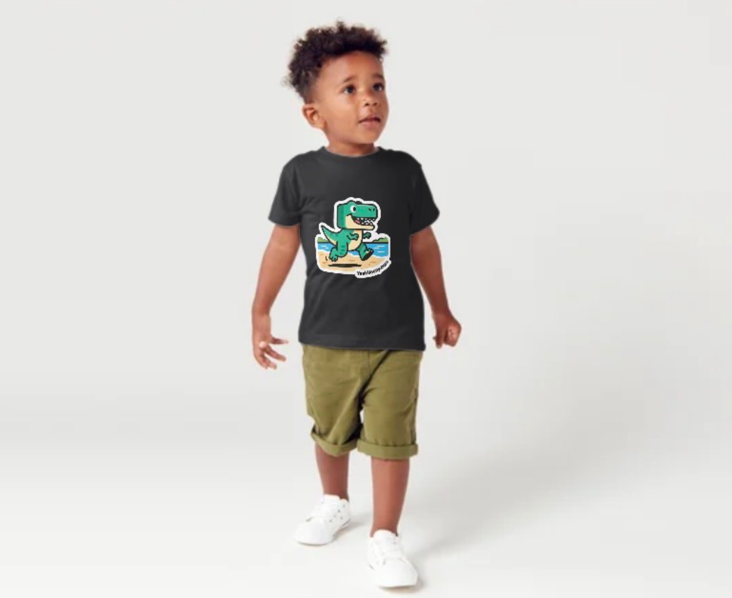 Photograph: child wearing YeahVacay black t-shirt — back view showing logo print on back of garment